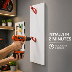 Person is installing a helmet hanger on wall with drill machine