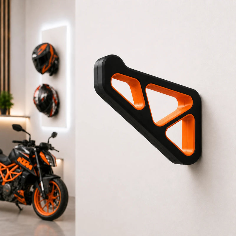 Dirt Accessories multi-color edition helmet hanger mounted on a garage wall, with blue accents and motorcycle helmets displayed in the background.